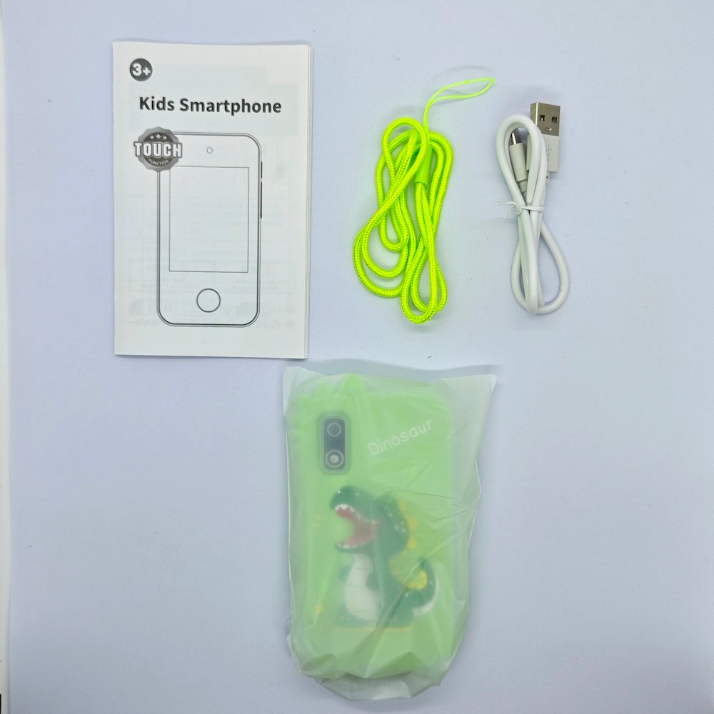 Complete kit of A10 laughing dinosaur touchscreen phone-shaped camera in green with accessories, CE/RoHS certified.
