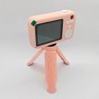 Y1 kids digital camera mounted on a matching pink tripod with a clear rear display for B2B wholesale.