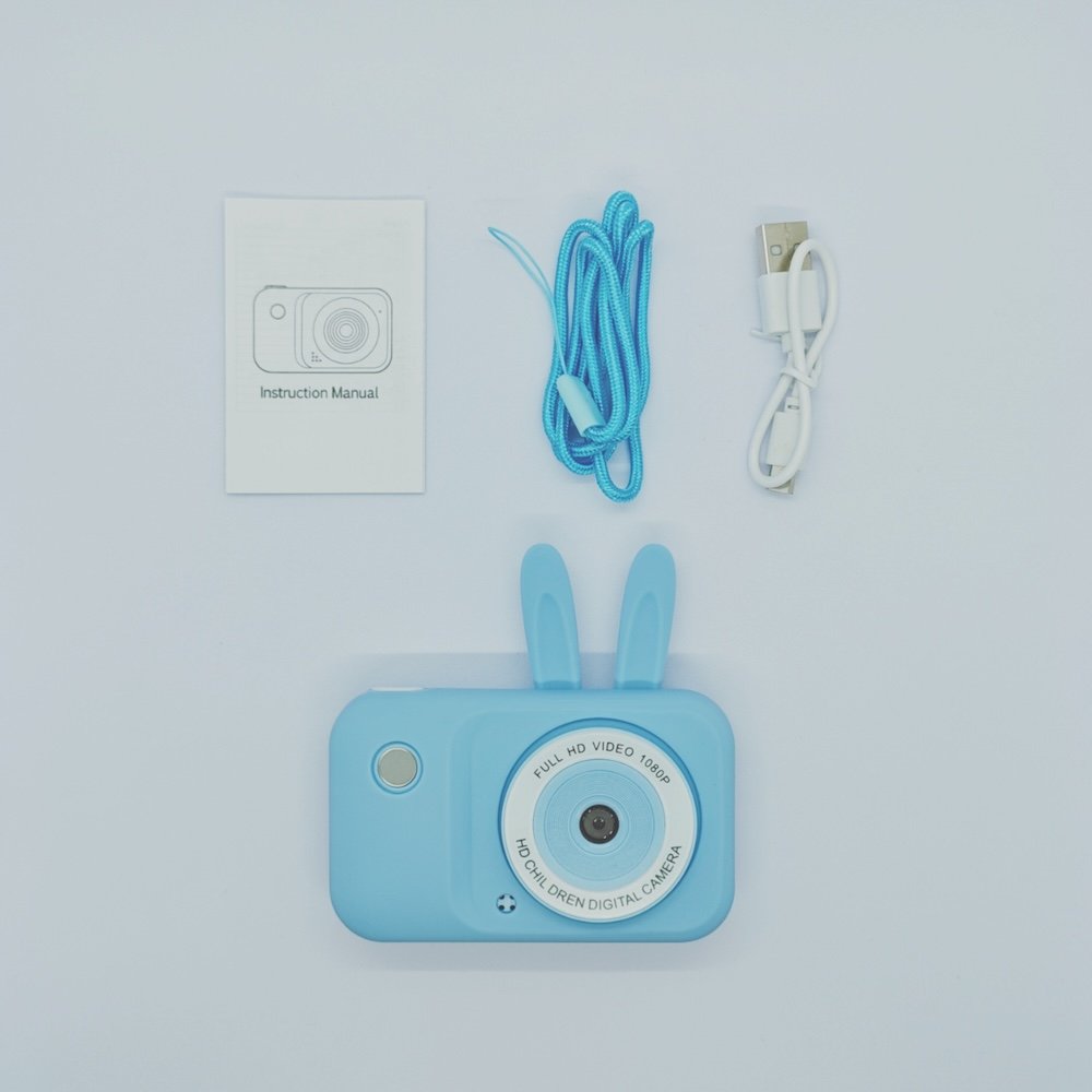 Complete package of Y2 bunny kids camera in blue with USB cable, lanyard and instruction manual - B2B children's electronics supplier.