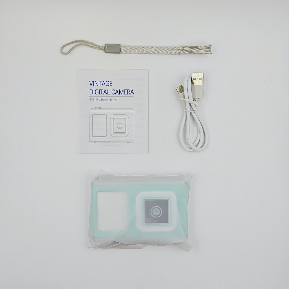 Full kit of Y23 green kids digital with modern design, including manual, USB cable and strap, wholesale from China factory.