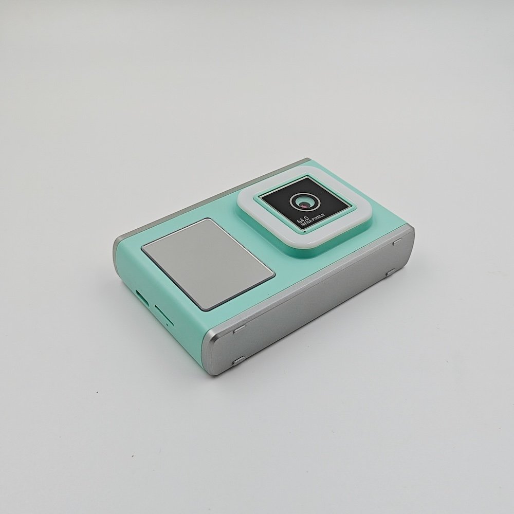 Close-up of Y23 green kids portable camera with square front lens, high-resolution imaging technology for kids tech toy distributors.
