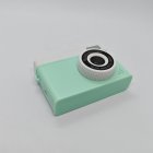 Top view of green retro kids digital camera with retro design, HD dual-camera for B2B retail orders, CE/RoHS/FCC certified.