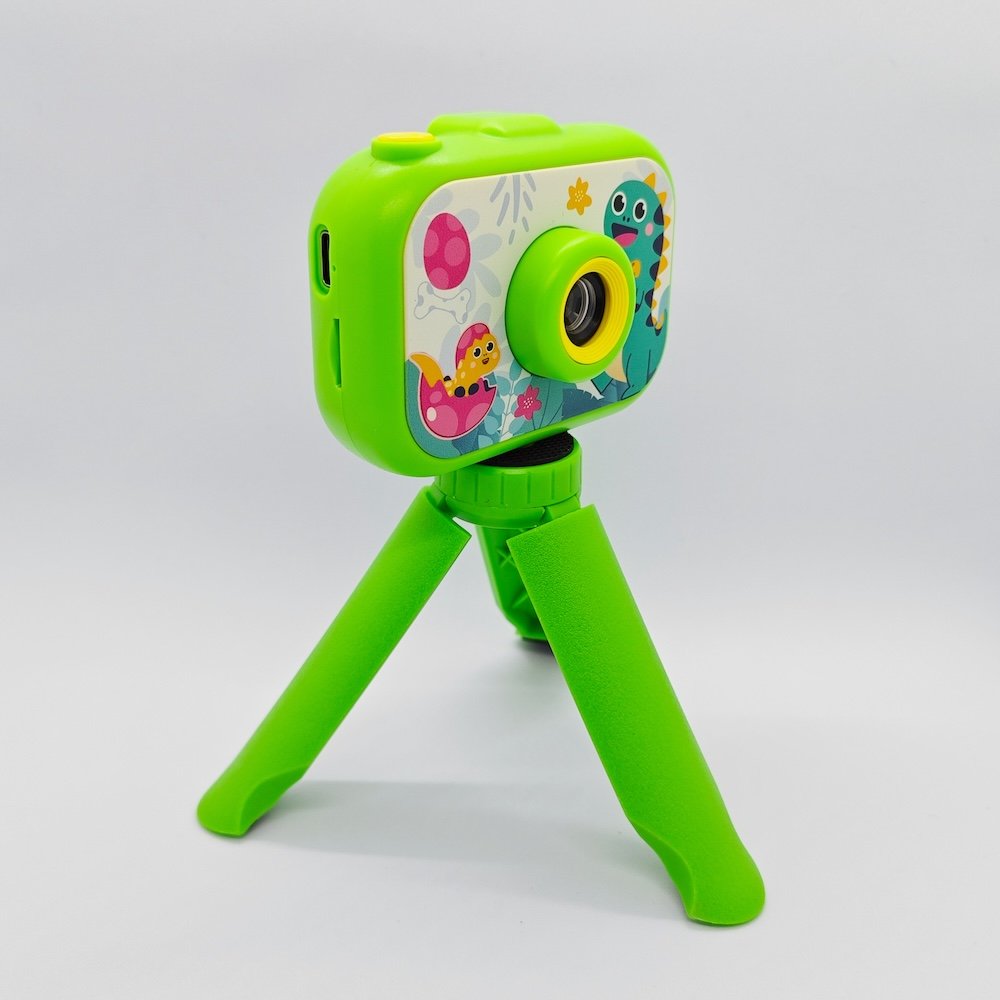 Y6 dual lens children digital camera with cute dinosaur patterns and matching green tripod for retailers.