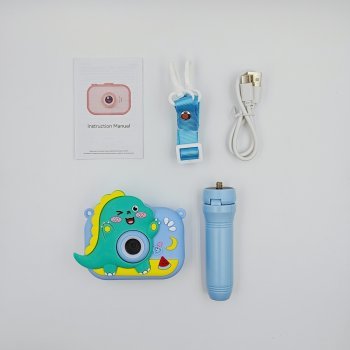 Wholesale Y6 kids camera set with 3D blue dinosaur silicone case, matching tripod, lanyard, USB cable and manual.