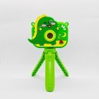 Y6 dual lens kids selfie camera with cute green dinosaur protective cover and stable tripod mount for B2B toys distributors.