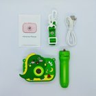 Wholesale Y6 kids camera set with 3D green dinosaur silicone case, matching tripod, lanyard, USB cable and manual.