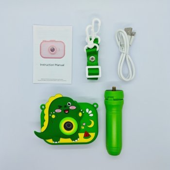 Wholesale Y6 kids camera set with 3D green dinosaur silicone case, matching tripod, lanyard, USB cable and manual.