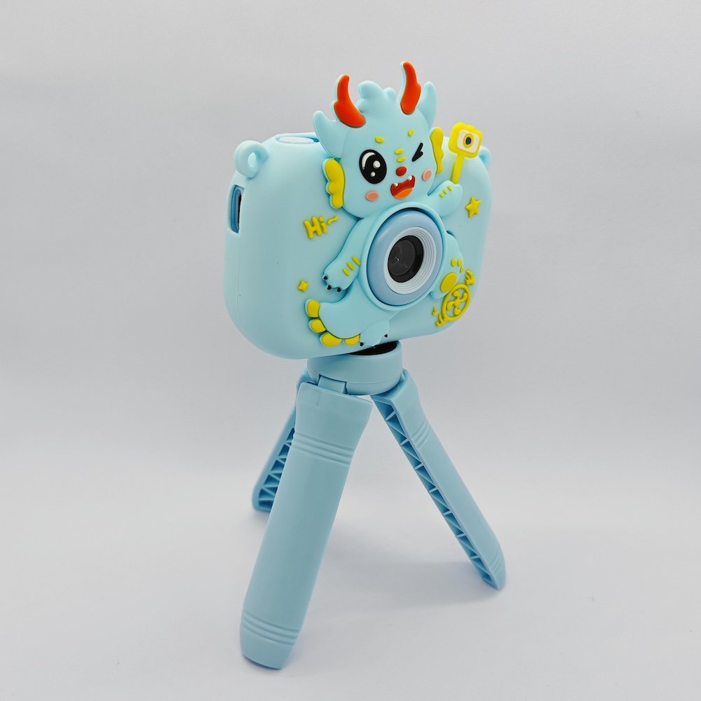 Y6 kids tripod camera dragon blue front Y6 shockproof silicone kids camera with 3D blue dragon scales, features USB-C port and memory card slot for retail.