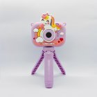 Y6 dual lens kids selfie camera with cute purple smile unicorn protective cover and stable tripod mount for B2B toys distributors.