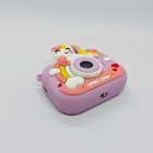Top view of compliant Y6 kids tripod camera with purple smile unicorn silicone case without stand.