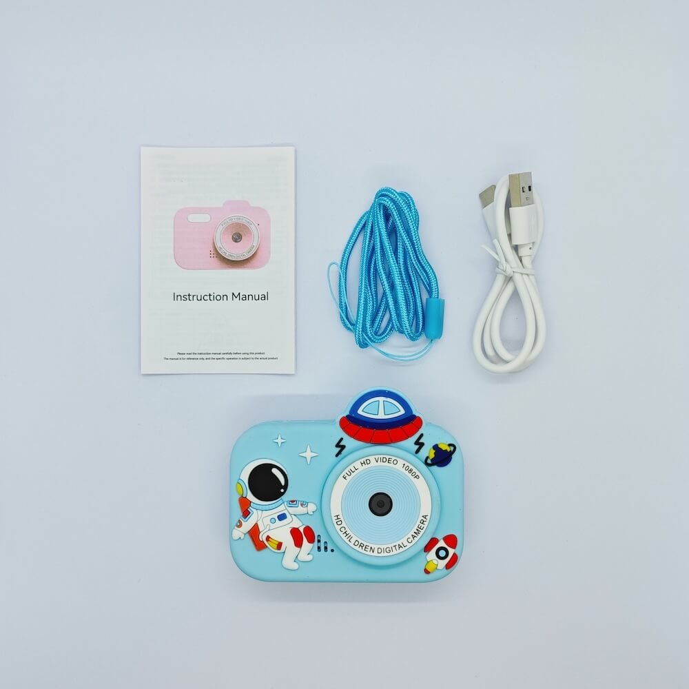 Wholesale Y8 classic astronaut kids camera kit with certified electronics, blue spacecraft silicone case, and retail accessories including manual, lanyard and USB cable.
