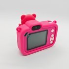 Rear view of Y8 rose pink kids camera showing the HD screen, white control buttons and selfie lens for retail suppliers.