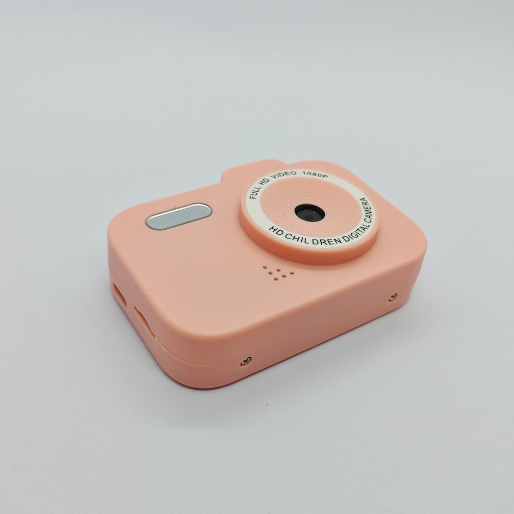 Top view of Y8 kids pink digital camera with classic design, featuring charging port and memory card slot.