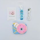 Wholesale full Y8 kids camera kit including blue silicone case with pink donut on it, USB cable, lanyard and manual for toy distributors.
