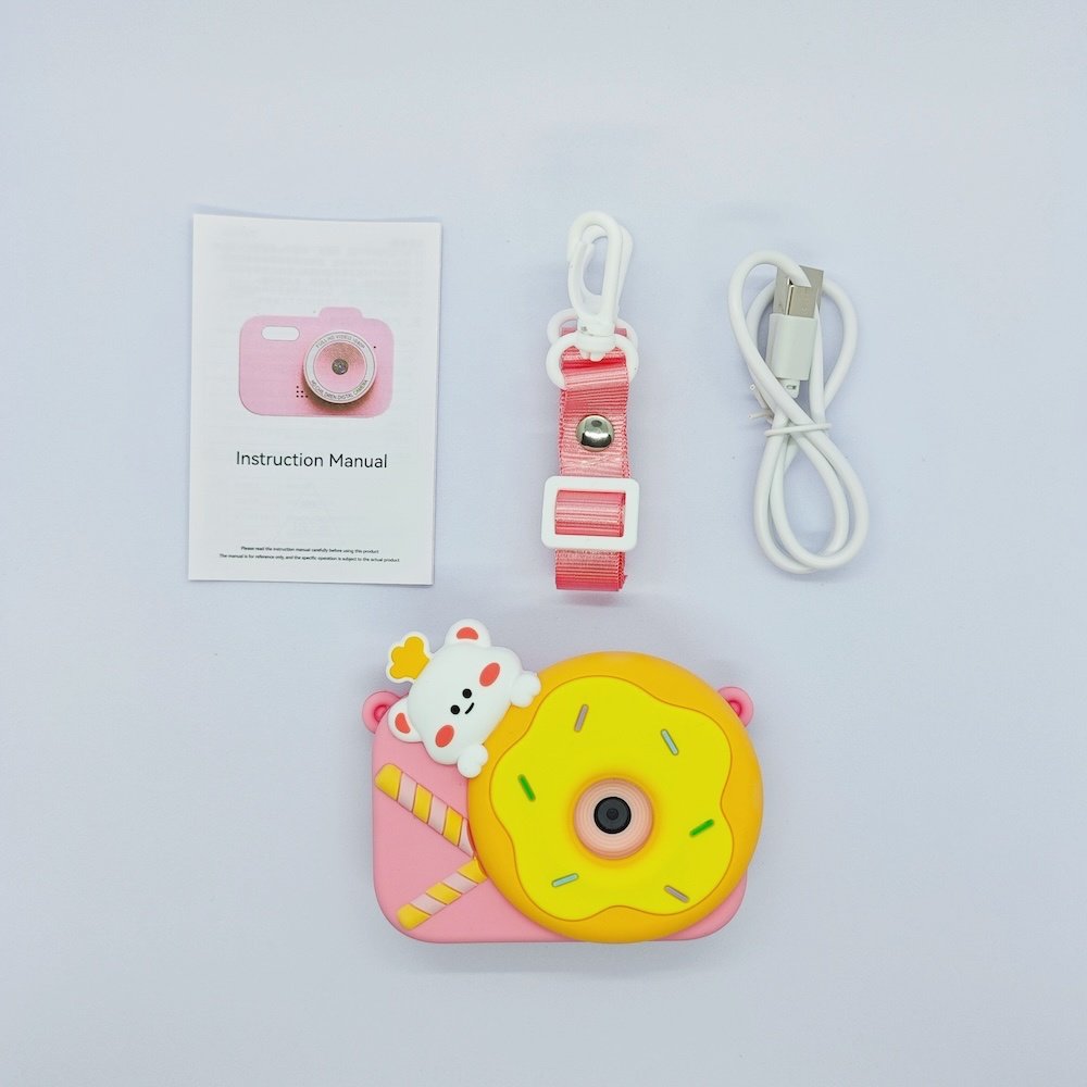 Wholesale full Y8 kids camera kit including pink silicone case with yellow donut on it, USB cable, lanyard and manual for toy distributors.