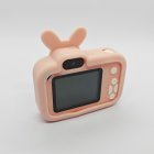 Back view of Y8 kids digital camera with pink rabbit&carrot silicone case, HD selfies camera, rear screen and white buttons, CE certified.