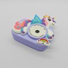 Top view of Y8 purple kids camera with winged unicorn design, HD dual lens, lightweight and portable.