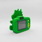 Rear view of CE certified Y8 kids camera with dark green dragon silicone cover, integrated 2.0-inch screen and yellow buttons.