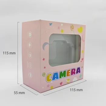 Dimension chart of the packaging box for Qisora Y6 kids digital camera with stand showing its size: 115 mm length, 55 mm width, 115 mm height.