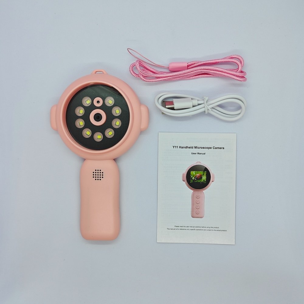Portable Y11 pink kids microscope set including USB cable, lanyard and user manual for retail distribution.