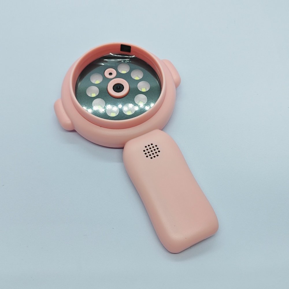 Close-up Y11 pink handheld microscope lens with integrated LED fill lights and speakers for kids toy wholesalers.
