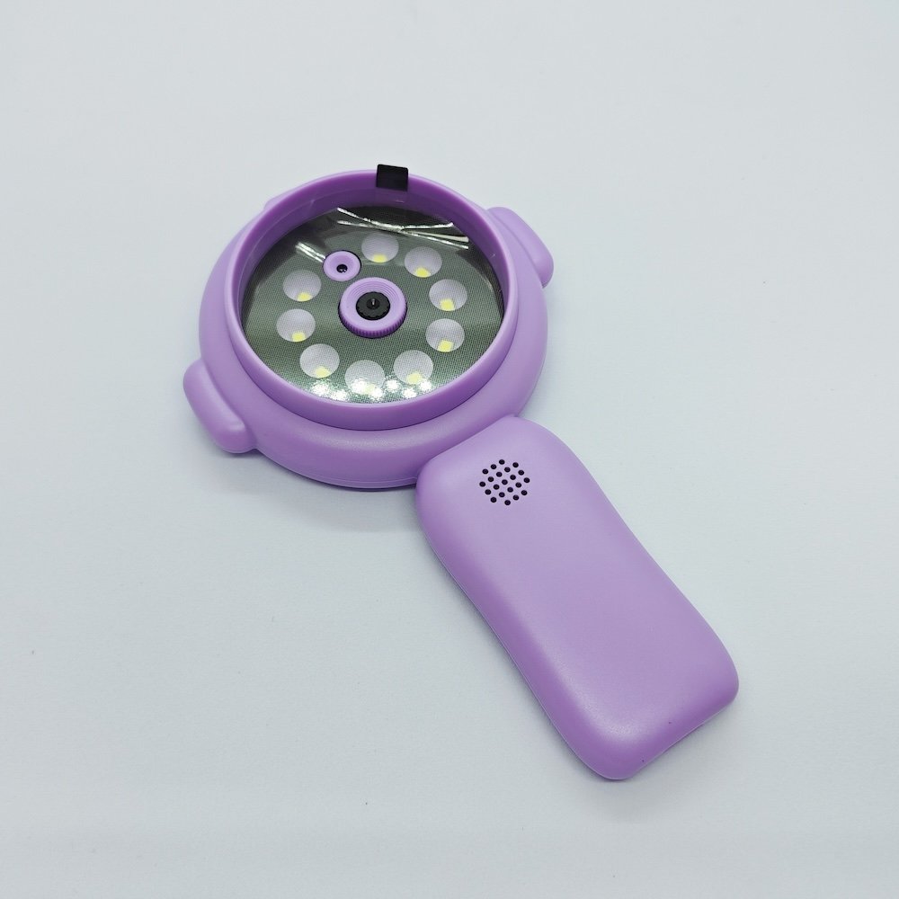 Close-up Y11 purple handheld microscope lens with integrated LED fill lights and speakers for kids toy wholesalers.