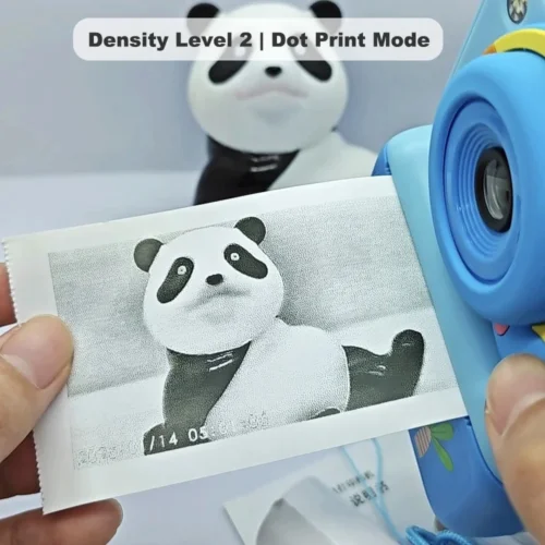 Real black-and-white thermal paper print sample of Y350 dinosaur kids instant print camera, showing high-contrast output in dot print mode at density level 2.