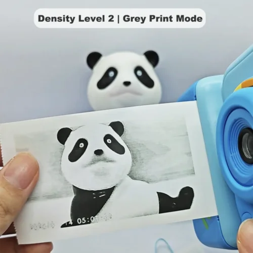 Real black-and-white thermal paper print sample of Y350 dinosaur kids instant print camera, showing high-contrast output in grey print mode at density level 2.