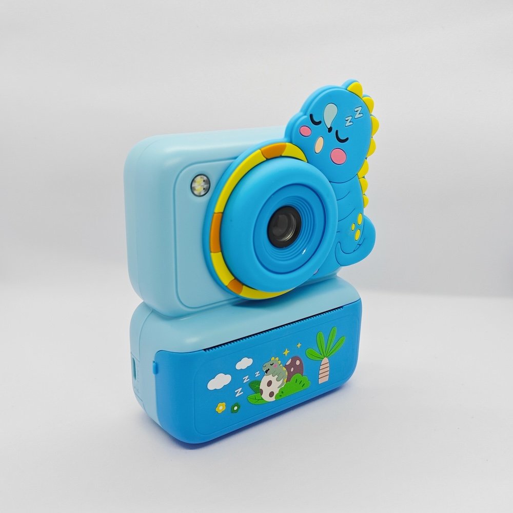 Y350 kids print camera sleeping dino blue front angle CE/RoHS certified blue Y350 kids instant camera with Dinosaur silicone cove, cute educational toy for wholesale gift market.