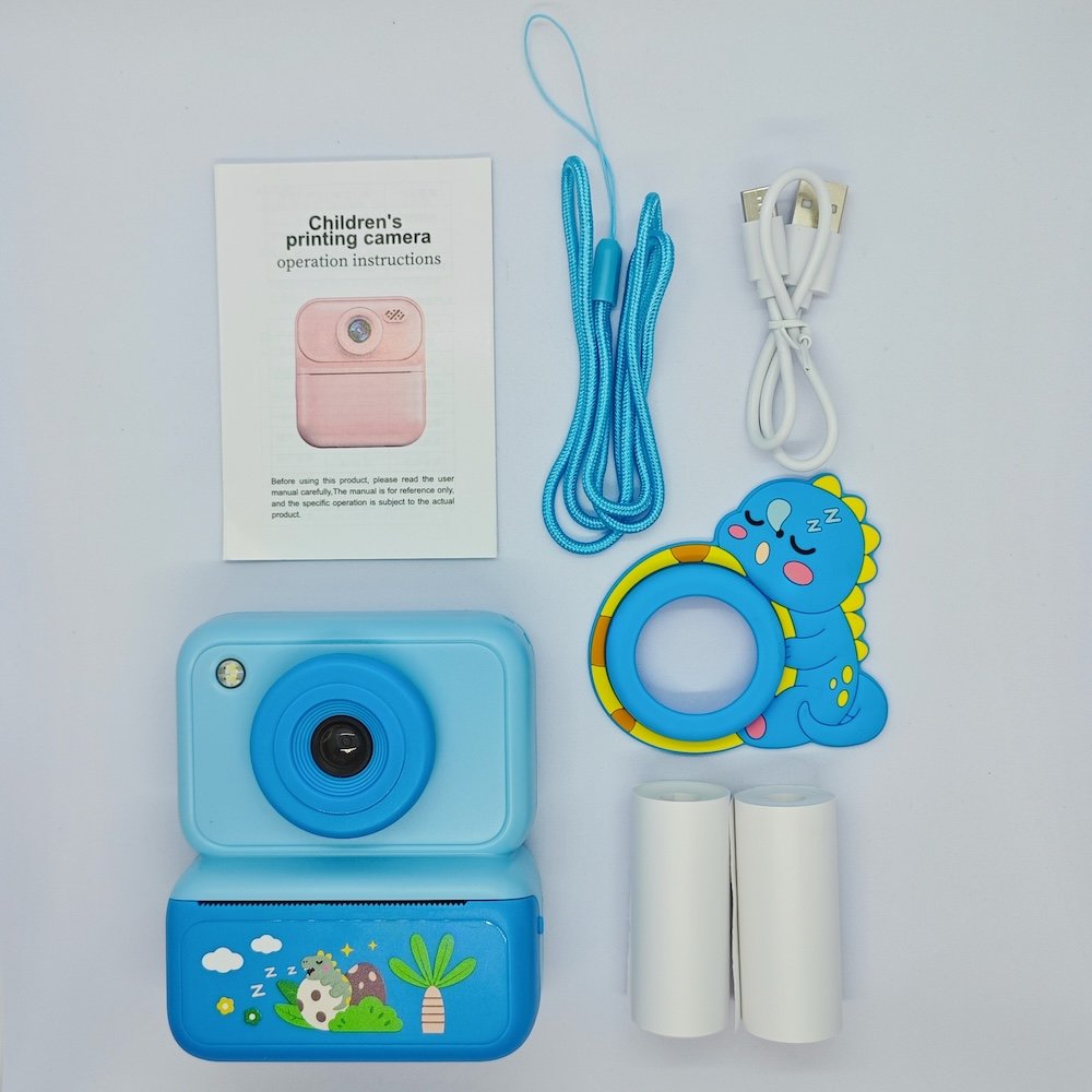 Full set of blue Dinosaur instant camera for kids, includes 2 rolls of thermal paper, lanyard and cable, factory price.