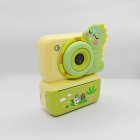 CE/RoHS certified green Y350 kids instant camera with Dinosaur silicone cove, cute educational toy for wholesale gift market.