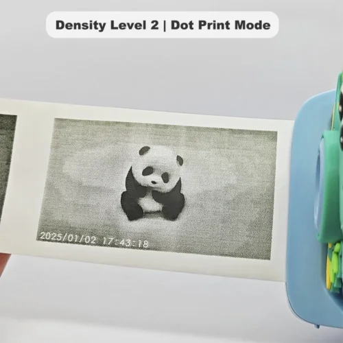 Real black-and-white thermal paper print sample of Y900 dino kids instant print camera, showing high-contrast output in dot print mode at density level 2.
