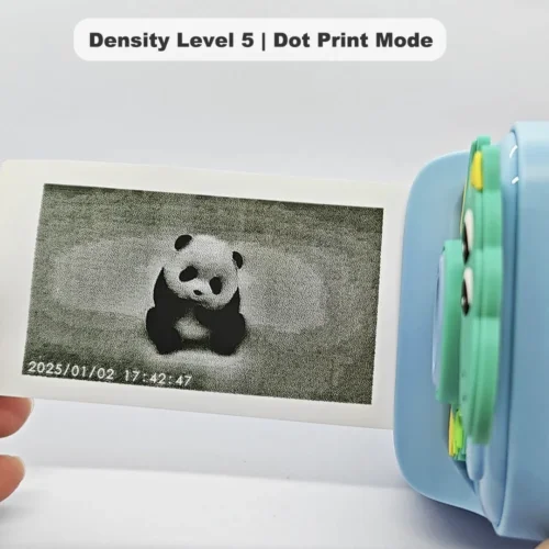 Real black-and-white thermal paper print sample of Y900 dino kids instant print camera, showing high-contrast output in dot print mode at density level 5.