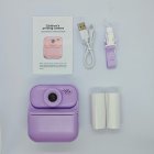 Complete kit of purple Y900 kids print camera, includes 2 rolls of thermal paper, lanyard and cable. RoHS/FCC certified toys for distributors.