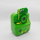 Wholesale Y900 dinosaur-themed kids instant print camera with green Dino silicone cover for toy importers.