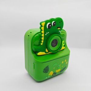 Wholesale Y900 dinosaur-themed kids instant print camera with green Dino silicone cover for toy importers.