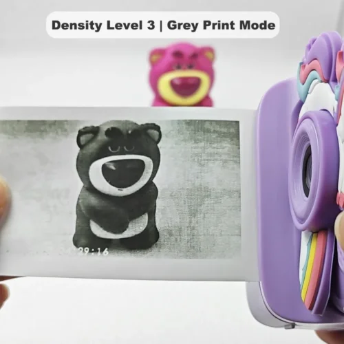 Real black-and-white thermal paper print sample of Y900 unicorn kids instant print camera, showing high-contrast output in grey print mode at density level 3.
